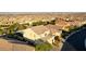 A high aerial shot shows the house surrounded by similar homes in a planned community at 426 Port Reggio St, Las Vegas, NV 89138