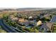 An aerial view of the house highlighting the pool, putting green, neighboring houses and mountain backdrop at 426 Port Reggio St, Las Vegas, NV 89138