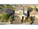 Aerial view of a two-story home with a well-manicured lawn and brick driveway at 426 Port Reggio St, Las Vegas, NV 89138