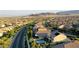 The house is showcased in an aerial view with pool, landscaped yard and mountains in the background at 426 Port Reggio St, Las Vegas, NV 89138