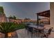 Inviting backyard featuring a pergola-covered dining area and well-maintained landscaping at 426 Port Reggio St, Las Vegas, NV 89138