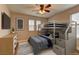 Cozy bedroom with bunk beds, ample storage, and calming decor, creating a perfect space for relaxation at 426 Port Reggio St, Las Vegas, NV 89138