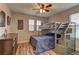 Bright bedroom featuring a bunk bed with built-in storage and wood-look floors at 426 Port Reggio St, Las Vegas, NV 89138