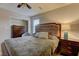 Cozy bedroom features a large bed with tufted headboard and neutral decor at 426 Port Reggio St, Las Vegas, NV 89138