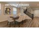 Virtually staged dining room with stylish chandelier, seating for six, and modern decor at 426 Port Reggio St, Las Vegas, NV 89138