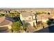 Charming two-story home with a well-manicured front yard, brick driveway and a putting green in the back at 426 Port Reggio St, Las Vegas, NV 89138