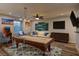Relax in this stylish game room, featuring a billiard table, comfortable seating, and entertainment options for the whole Gathering at 426 Port Reggio St, Las Vegas, NV 89138