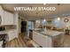 Open-concept kitchen showcasing a large island and seamless transition to the living area at 426 Port Reggio St, Las Vegas, NV 89138