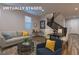 Comfortable living room with sleek furniture, decor, and a view of the staircase at 426 Port Reggio St, Las Vegas, NV 89138