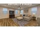 Bright living room with modern furniture, a sleek TV setup, and a cozy ambiance at 426 Port Reggio St, Las Vegas, NV 89138