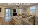 Inviting living room with stylish furniture and a seamless transition to the outdoor space at 426 Port Reggio St, Las Vegas, NV 89138