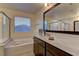 Luxurious main bathroom features a soaking tub, and a vanity with a marble countertop at 426 Port Reggio St, Las Vegas, NV 89138