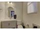 Charming powder room with circular mirror, modern fixtures, and natural light at 426 Port Reggio St, Las Vegas, NV 89138
