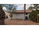 Back of the home, showing the roof, windows and trees in the backyard at 4341 San Mateo St, North Las Vegas, NV 89032
