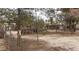 Backyard showing sheds and fencing with trees at 4341 San Mateo St, North Las Vegas, NV 89032