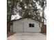 Modest home exterior with a simple design and mature trees at 4341 San Mateo St, North Las Vegas, NV 89032