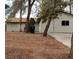 Home exterior with mature trees and a desert landscape at 4341 San Mateo St, North Las Vegas, NV 89032