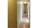 Hallway featuring tiled flooring, connecting various rooms in the home at 4341 San Mateo St, North Las Vegas, NV 89032