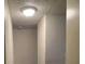 View of the hallway ceiling with dated texture and a light fixture at 4341 San Mateo St, North Las Vegas, NV 89032
