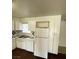 The kitchen features white cabinets, black appliances, and a white refrigerator at 4341 San Mateo St, North Las Vegas, NV 89032