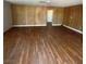 The living room features wood paneling and laminate flooring at 4341 San Mateo St, North Las Vegas, NV 89032