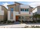Beautiful two-story home with desert landscaping, unique facade, and orange door at 4514 Sapphire Moon Ave, North Las Vegas, NV 89084
