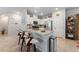 Modern kitchen featuring granite countertops, stainless steel appliances, and a convenient breakfast bar for casual dining at 4514 Sapphire Moon Ave, North Las Vegas, NV 89084