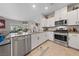 Well-equipped kitchen with stainless appliances, granite counters, and ample natural light for a delightful cooking experience at 4514 Sapphire Moon Ave, North Las Vegas, NV 89084
