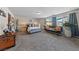 Bright and airy primary bedroom with ample space and comfortable furnishings at 4514 Sapphire Moon Ave, North Las Vegas, NV 89084