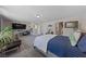 Spacious primary bedroom with comfortable seating area, large bed, and natural light at 4514 Sapphire Moon Ave, North Las Vegas, NV 89084