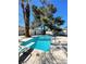 Backyard pool with diving board, surrounded by mature trees at 4560 Rancho Hills Dr, Las Vegas, NV 89119