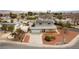 Aerial view of the home showcasing landscaping, a driveway, and solar panels at 4690 San Benito St, Las Vegas, NV 89121