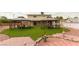 Backyard featuring two gazebos with a lawn and brick walkways at 4690 San Benito St, Las Vegas, NV 89121