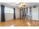 Bright bedroom with hardwood floors, ceiling fan and mirrored wall detail at 4690 San Benito St, Las Vegas, NV 89121