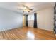 Spacious bedroom featuring hardwood floors, a ceiling fan and window for natural light at 4690 San Benito St, Las Vegas, NV 89121