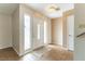 Bright foyer with neutral walls, light-colored tile floor, and a decorative glass front door at 4690 San Benito St, Las Vegas, NV 89121