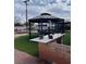 Outdoor living space with gazebo and outdoor kitchen and seating at 4690 San Benito St, Las Vegas, NV 89121