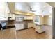Charming kitchen with tiled backsplash, stainless steel appliances, and eat-in breakfast bar at 4690 San Benito St, Las Vegas, NV 89121
