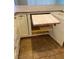 A pull out cutting board inside of a kitchen cabinet at 4690 San Benito St, Las Vegas, NV 89121