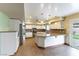 Spacious kitchen featuring granite countertops, stainless steel appliances and backyard access at 4690 San Benito St, Las Vegas, NV 89121