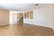 Neutral living room with tile flooring, showing stairs and an accent wall with decorative panels at 4690 San Benito St, Las Vegas, NV 89121