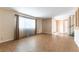Neutral living room, open concept, with tile flooring, showing front door and staircase at 4690 San Benito St, Las Vegas, NV 89121