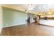 Open floor plan showcasing tile floors, ceiling fans, and seamless flow into the modern kitchen at 4690 San Benito St, Las Vegas, NV 89121