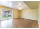Bright living room featuring tile floors, ceiling fan and sliding door access to the backyard at 4690 San Benito St, Las Vegas, NV 89121