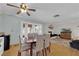 Cozy dining room featuring wood floors, and glass patio doors providing ample natural light at 4850 La Fonda Dr, Las Vegas, NV 89121