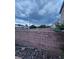 Spacious backyard enclosed by a brick wall, perfect for outdoor activities and privacy at 4900 Whisper Lake Ave, Las Vegas, NV 89131