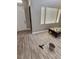 Living area features wood-look floors, neutral walls, and window blinds at 4900 Whisper Lake Ave, Las Vegas, NV 89131