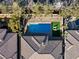 Aerial view showcasing a private pool, lush greenery, and an outdoor lounge area at 50 Carolina Cherry Dr, Las Vegas, NV 89141