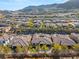 An aerial view showing multiple homes in a community, each with a backyard pool at 50 Carolina Cherry Dr, Las Vegas, NV 89141