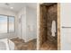 Elegant bathroom with a tiled walk-in shower and glass door at 50 Carolina Cherry Dr, Las Vegas, NV 89141